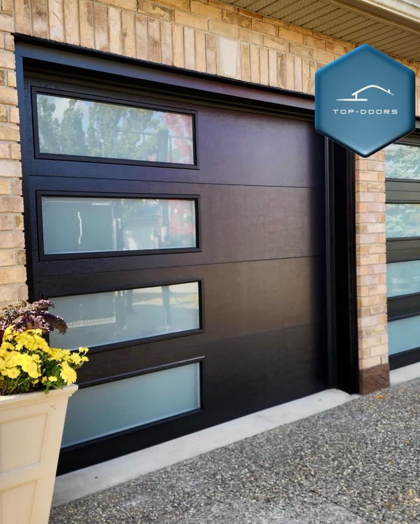 Modern glass-panel garage door installed by Top Doors